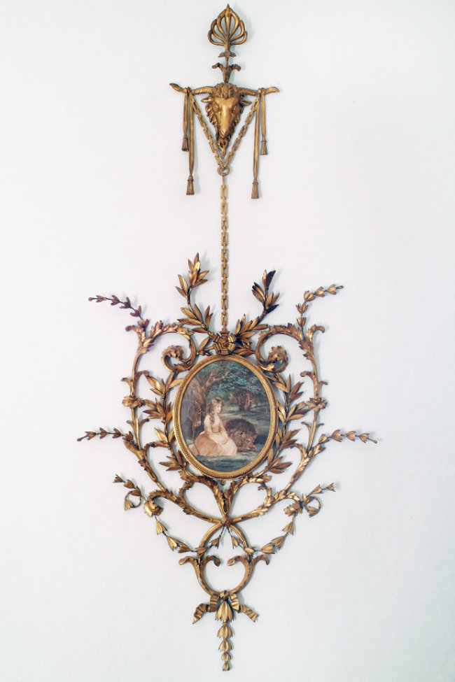 Eighteenth-century wall appliqué with centre engraving, n.d., carved wood, gilt gesso, and coloured stipple engraving, 175 cm. Presented, John