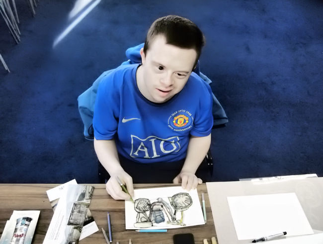 Photo: John Keating at work on a print. Courtesy of Crawford Supported Studio.