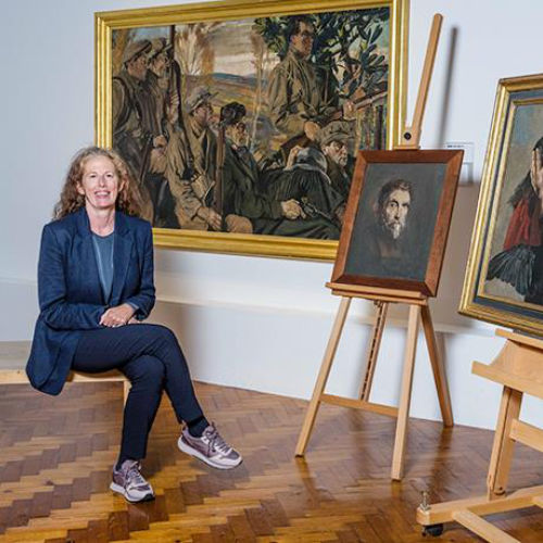 Mary McCarthy, Director of the Crawford Art Gallery, was photographed at the unveiling of four new artworks acquired by the gallery for the National Collection in October 2024. She is pictured alongside Sean Keating’s Elijah with the Ravens, Version II (1930), his self-portrait`(c. 1961), and the gallery’s previously acquired Men of the South. Photo: Joleen Cronin