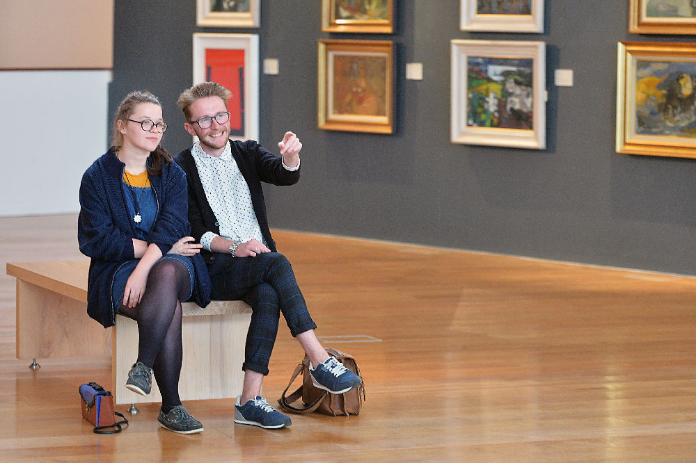 Two people enjoying the collection. Photo by Provision.