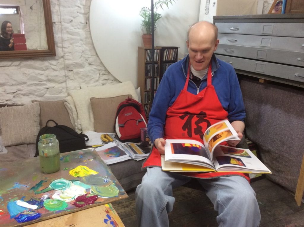 Photo: Tom O’Sullivan in fellow artist Tom Climent’s studio space. Courtesy of the Artist and Crawford Supported Studio facilitator Mairead O’Callaghan.